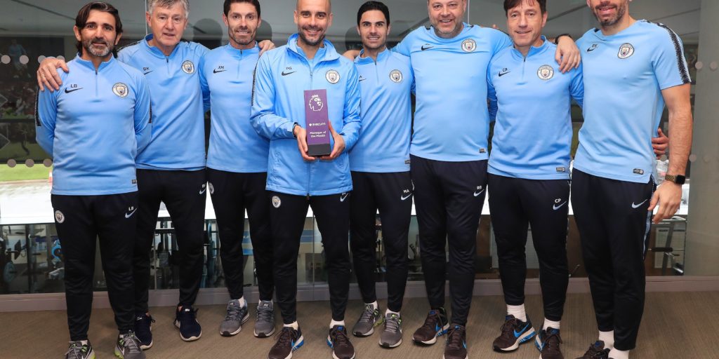 Pep Guardiola with a Barclays Manager of the Month award during his Manchester City reign