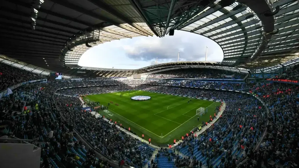 Man City appeal verdict: An interior wide-angle view of the Etihad Stadium filled with spectators.